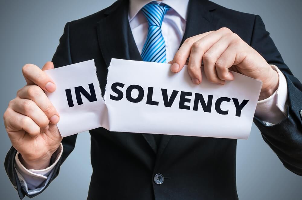 Why is it crucial to understand and maintain financial solvency